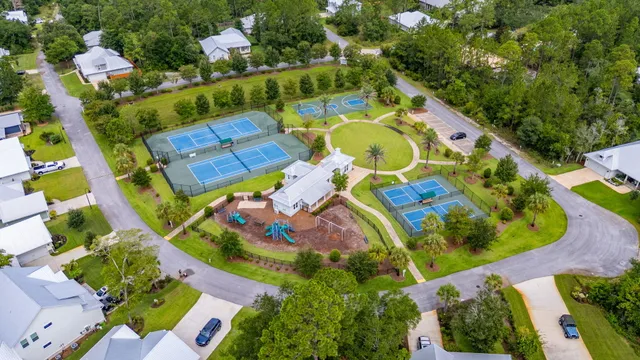 a view of a park with swings and slides