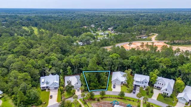 an aerial view of a house with a garden
