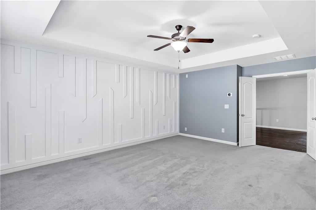 330 Avalon Square Fairburn, GA 30213 - Photo 25 of 52 a view of an empty room with a chandelier fan