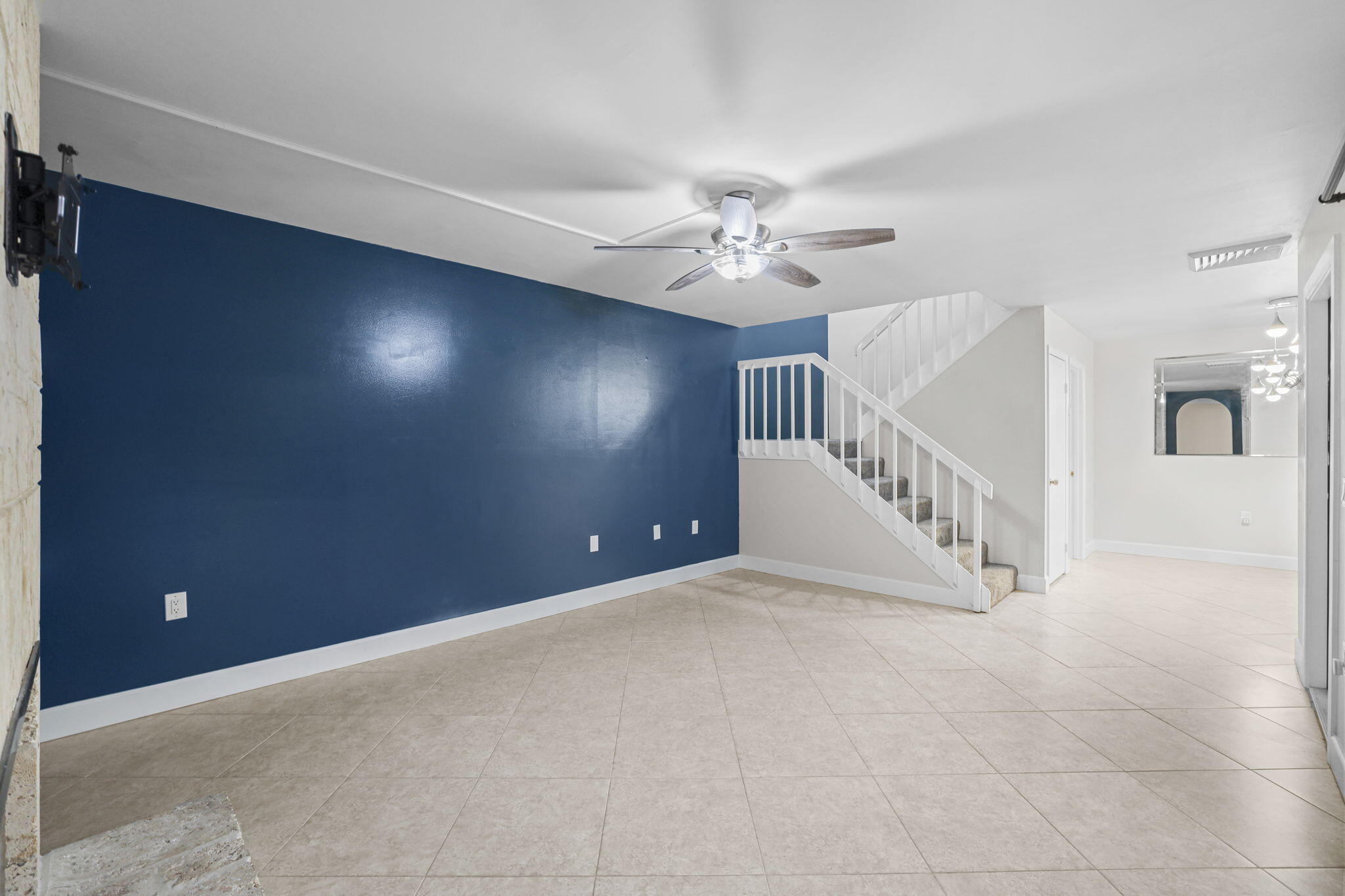 617 6th Lane Palm Beach Gardens, FL 33418 - Photo 12 of 49 en view interior of a house with stairs and a chandelier fan