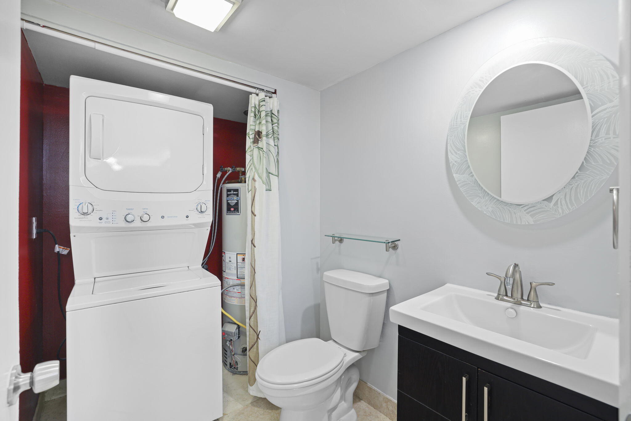 617 6th Lane Palm Beach Gardens, FL 33418 - Photo 15 of 49 a bathroom with a toilet sink vanity and mirror