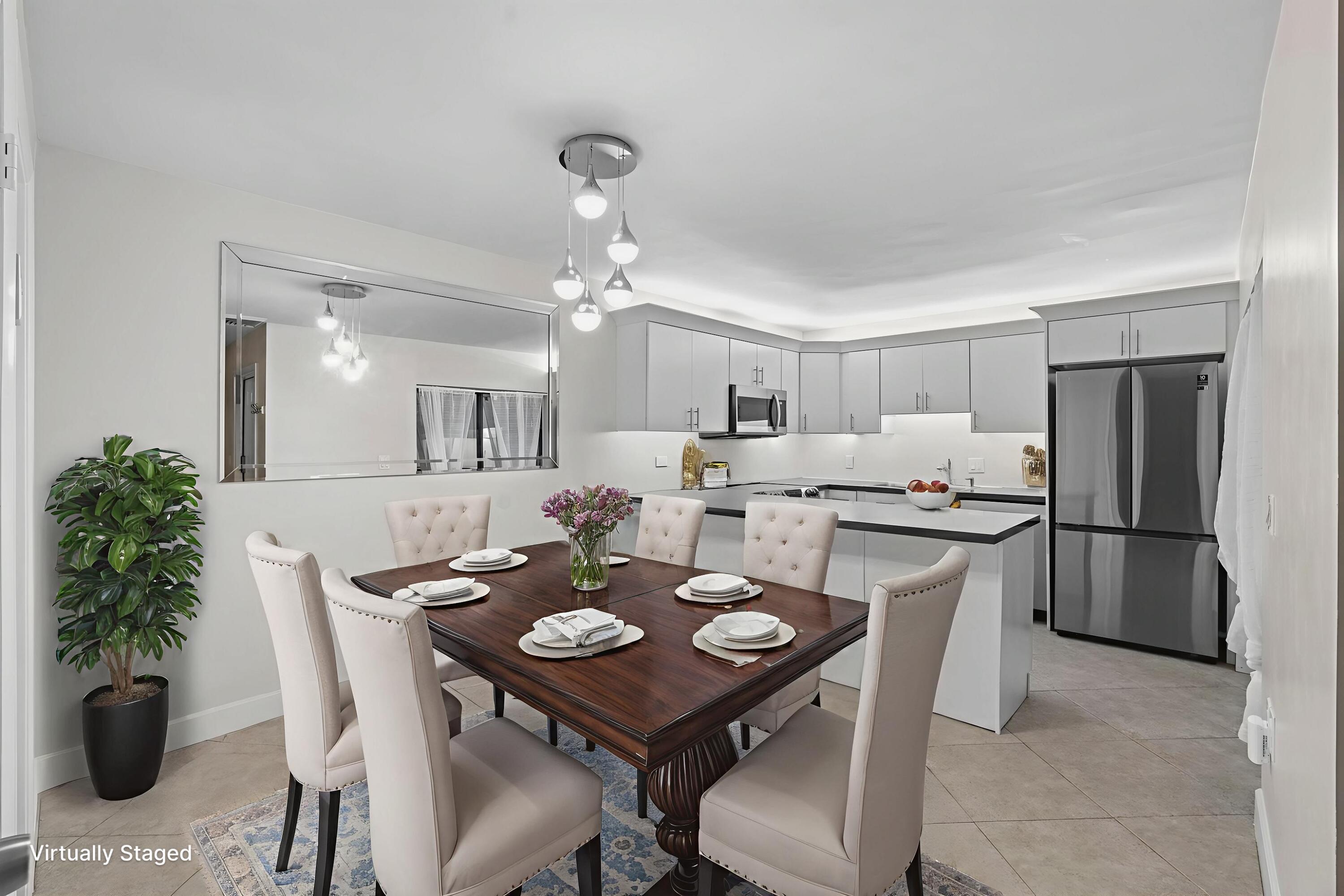 617 6th Lane Palm Beach Gardens, FL 33418 - Photo 18 of 49 a kitchen with a table and chairs in it