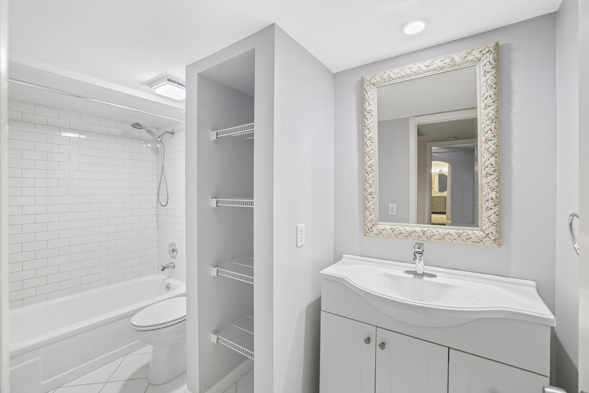 617 6th Lane Palm Beach Gardens, FL 33418 - Photo 25 of 49 a bathroom with a sink toilet and shower