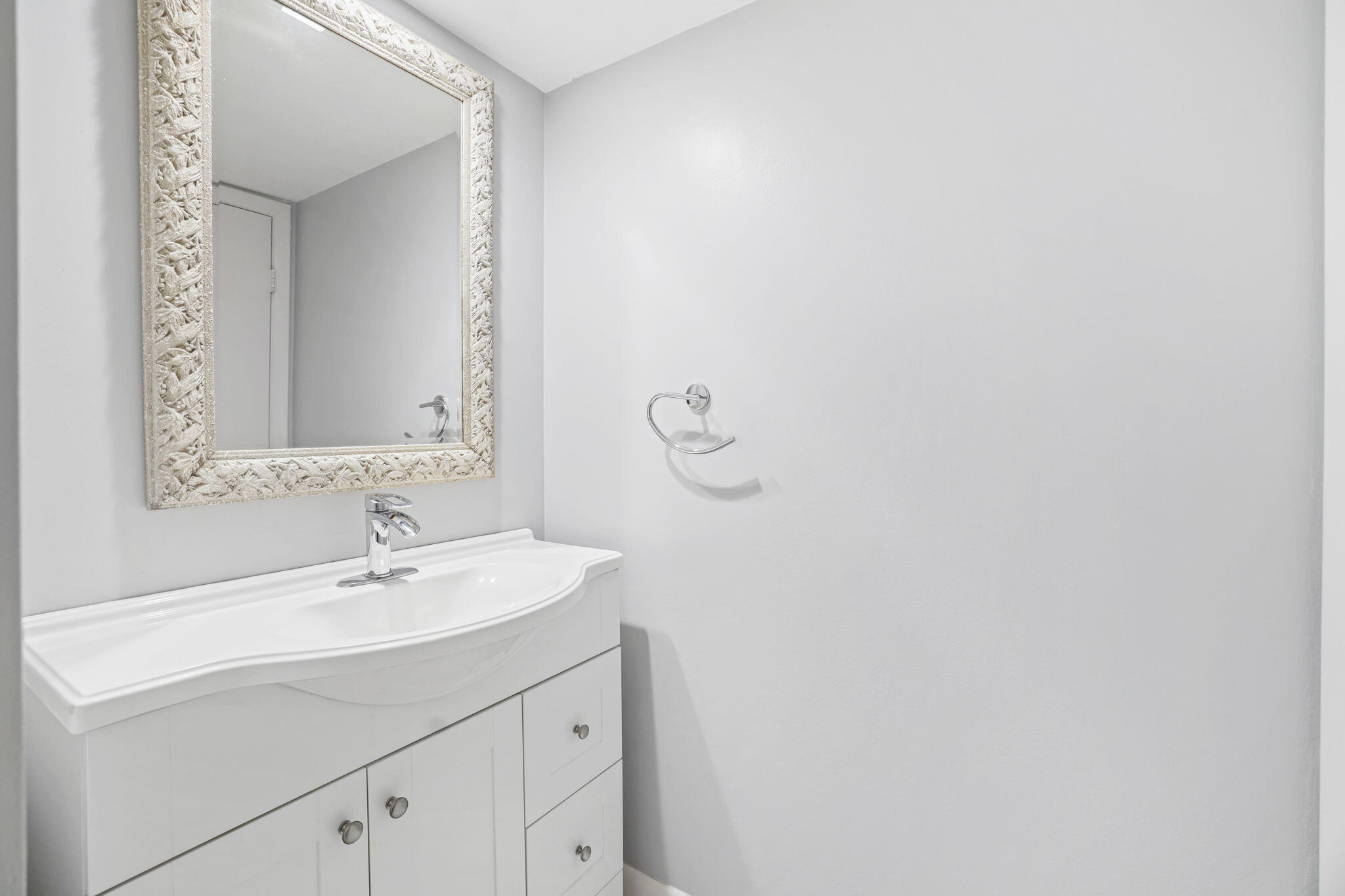 617 6th Lane Palm Beach Gardens, FL 33418 - Photo 26 of 49 a bathroom with a sink and a mirror