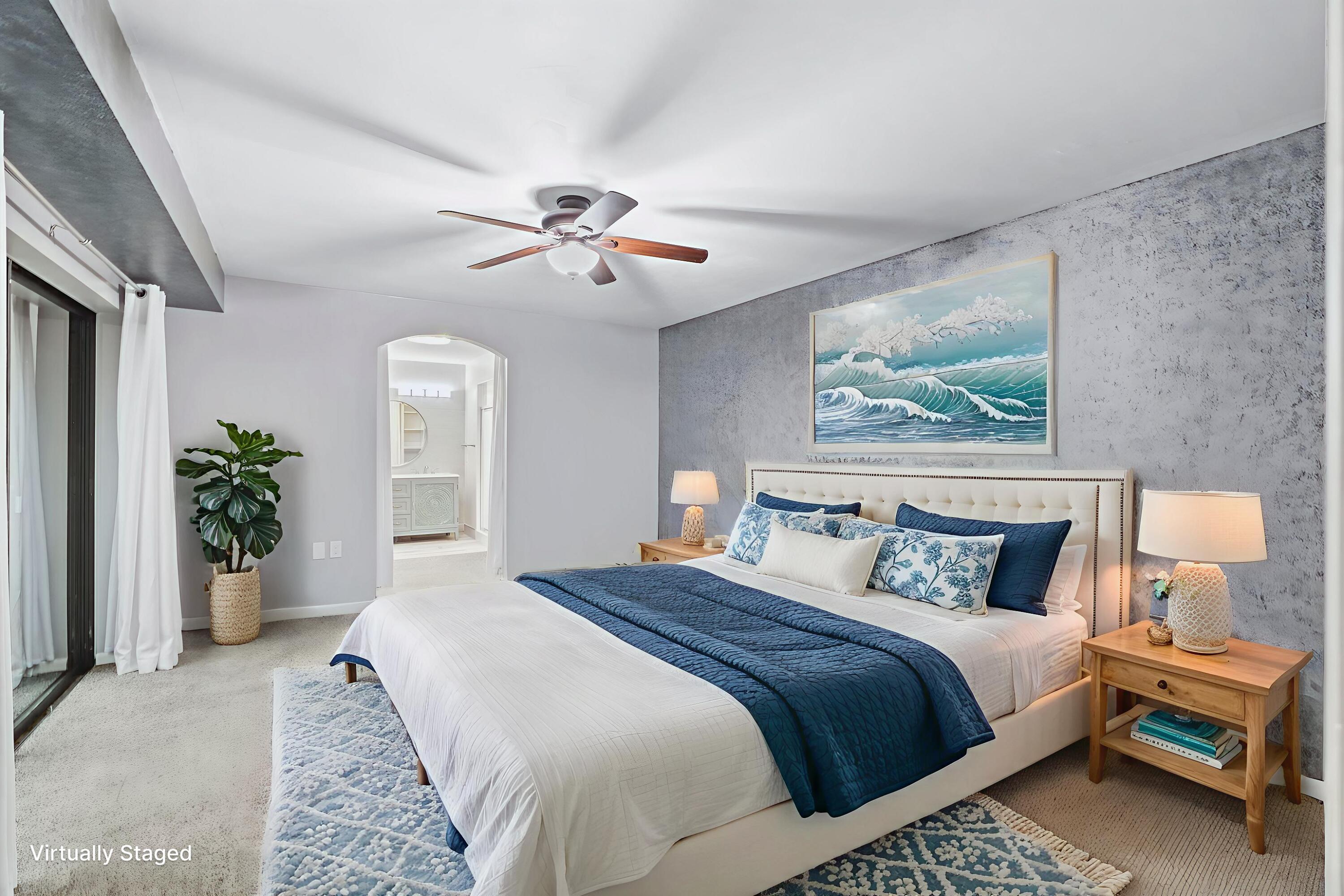 617 6th Lane Palm Beach Gardens, FL 33418 - Photo 32 of 49 a bedroom with a large bed and a chandelier