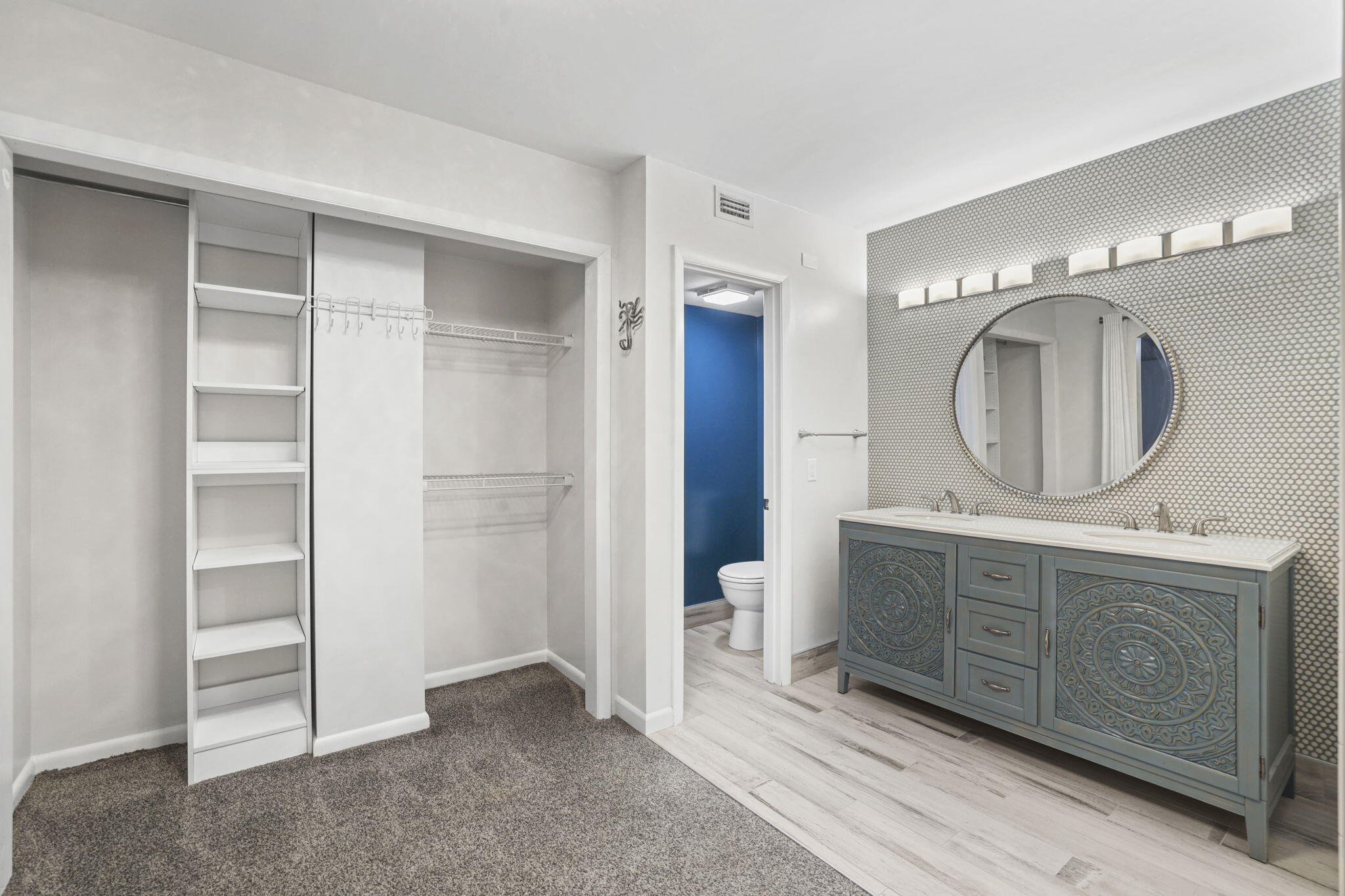 617 6th Lane Palm Beach Gardens, FL 33418 - Photo 35 of 49 a view of living room with cabinets and a mirror