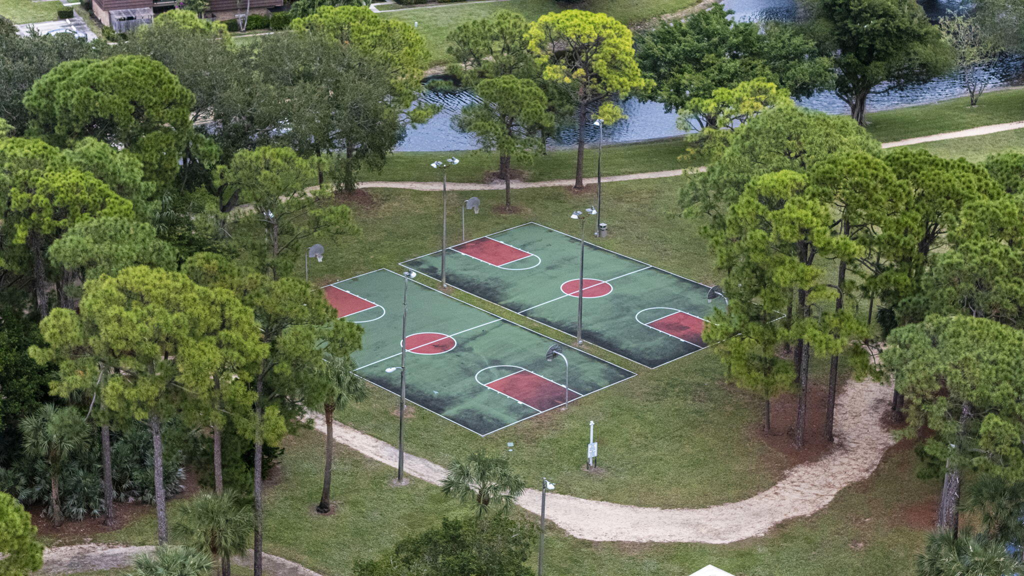 617 6th Lane Palm Beach Gardens, FL 33418 - Photo 47 of 49 an aerial view of a dining space with lots of trees