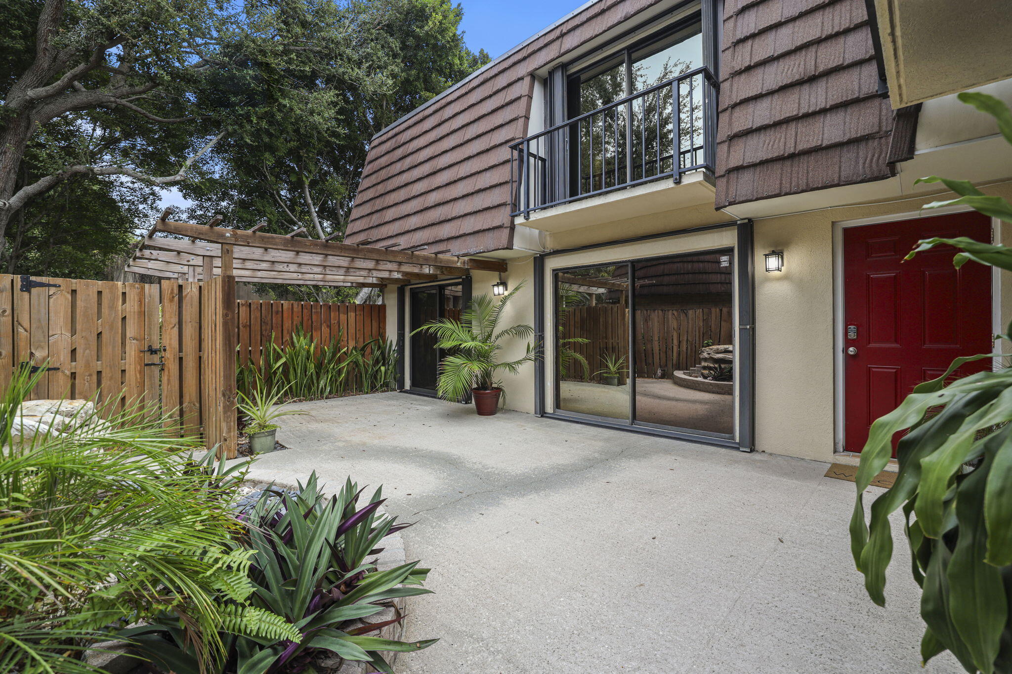 617 6th Lane Palm Beach Gardens, FL 33418 - Photo 7 of 49 a house with a potted plant in front of it