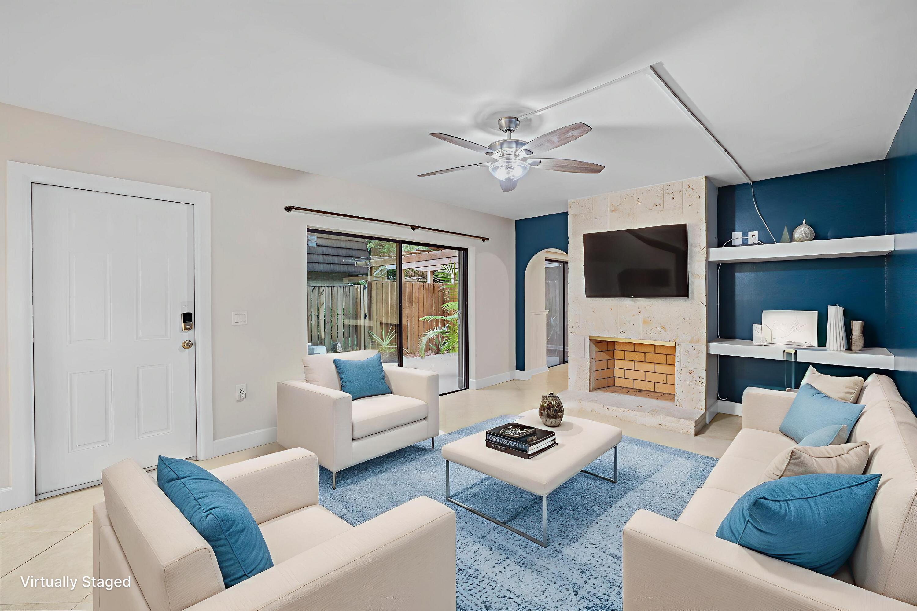 617 6th Lane Palm Beach Gardens, FL 33418 - Photo 10 of 49 a living room with furniture and a flat screen tv