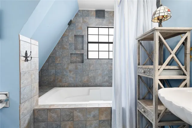 a view of a storage & utility room with dryer and washer