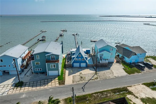 an aerial view of a house with a garden