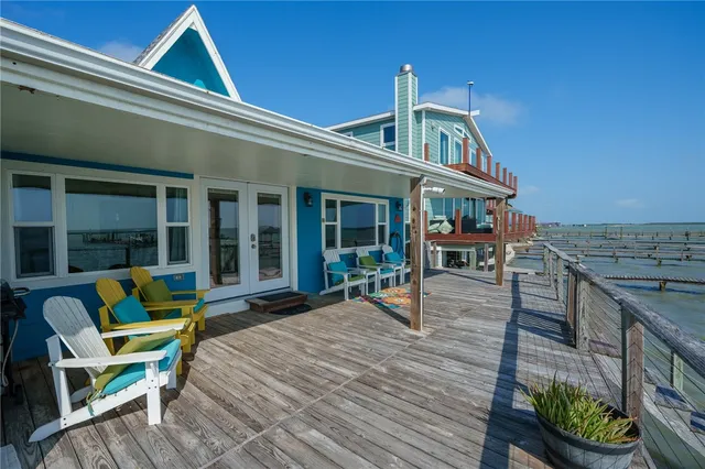 a front view of a house with outdoor seating