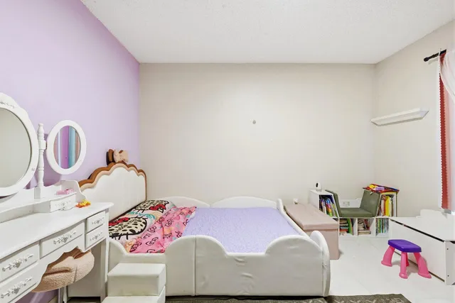 a bathroom with a sink a toilet and shower curtain