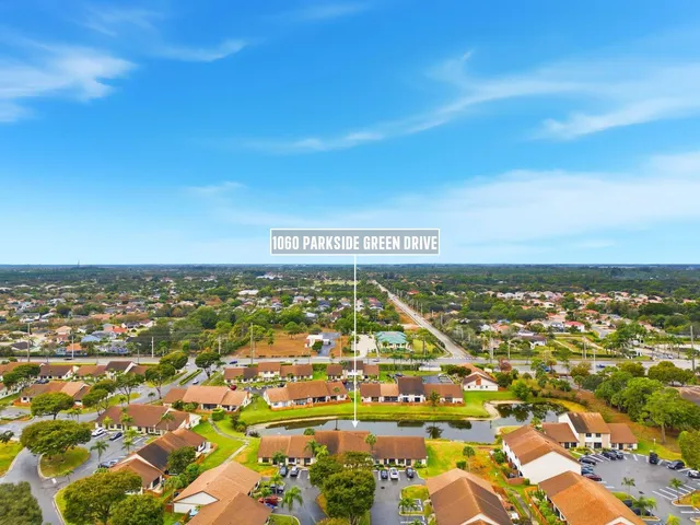 an aerial view of residential building and car parked