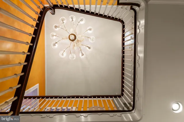 a view of an empty room with large windows