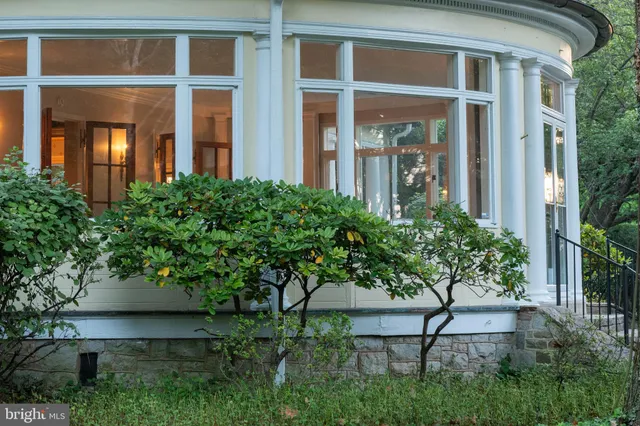 a front view of a building with garden