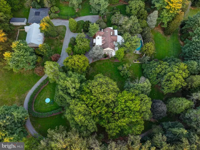 an aerial view of a house with yard