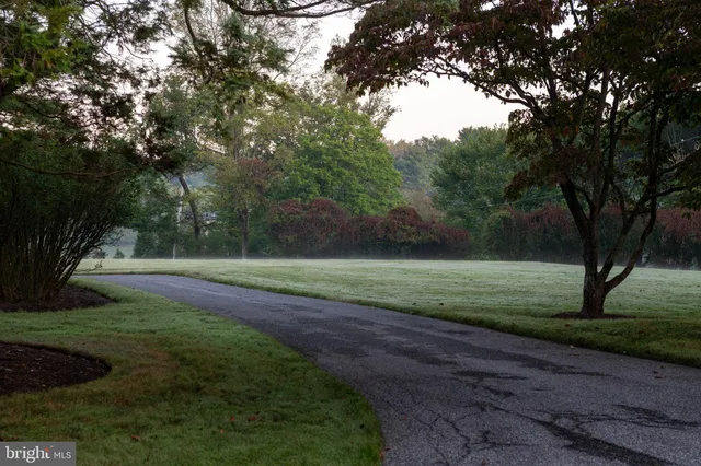 a view of house with outdoor space and sitting area