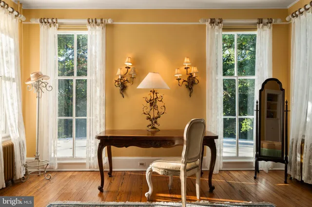 a room with a chair and a window