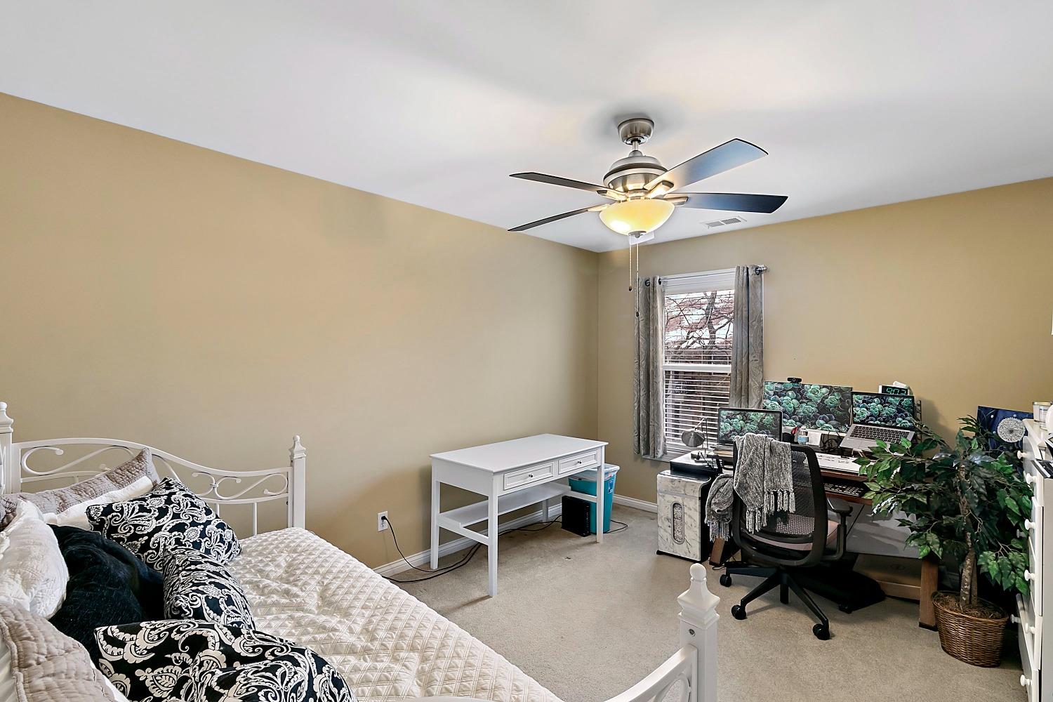 365 Cottage View Terrace Valparaiso, IN 46383 - Photo 12 of 17 a bedroom with a bed and a chandelier