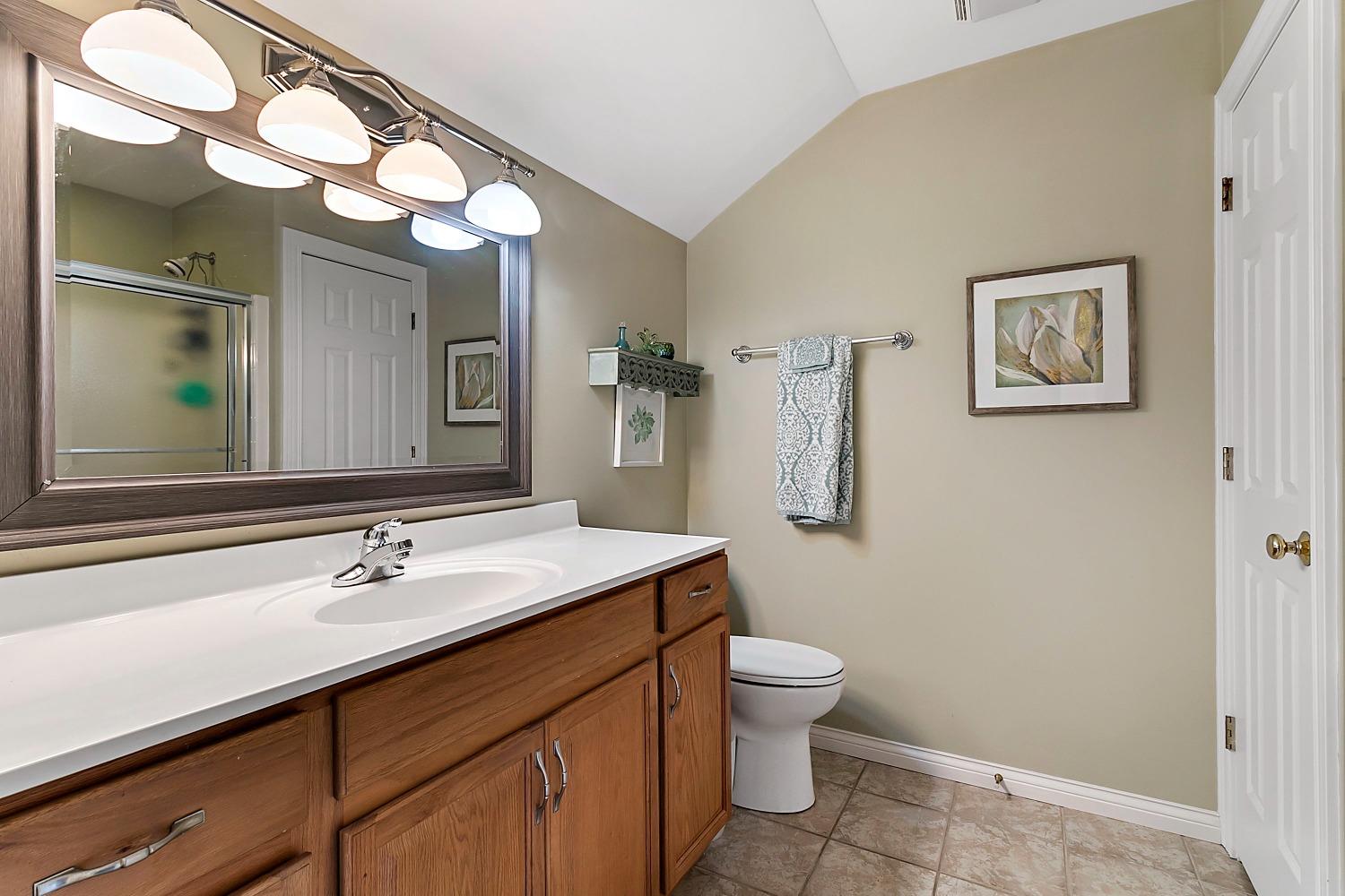 365 Cottage View Terrace Valparaiso, IN 46383 - Photo 16 of 17 a bathroom with a toilet sink and mirror
