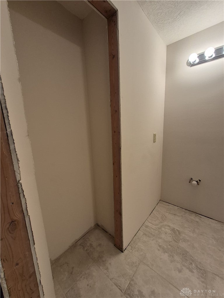633 Orient Way Hamilton, OH 45013 - Photo 64 of 68 This interior space features durable tile flooring, providing a practical foundation for a new bathroom design.