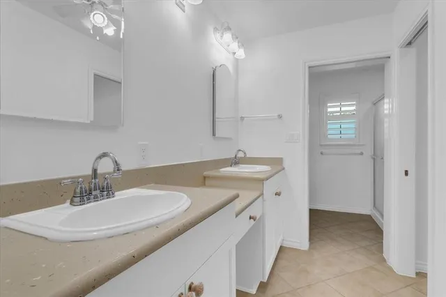 a bathroom with a sink double vanity and a mirror