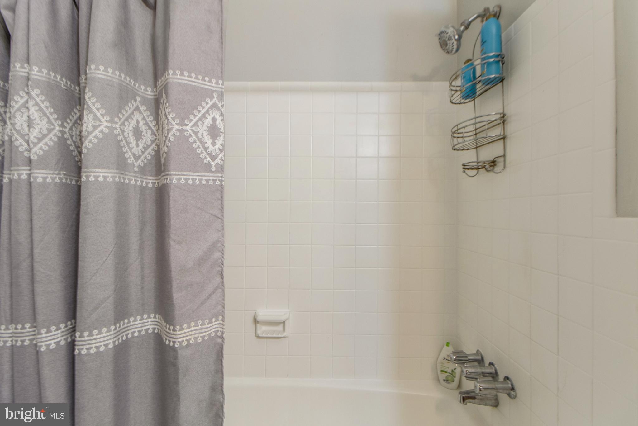 6311 Barrs Lane Lanham, MD 20706 - Photo 15 of 54 a bath tub sitting next to a shower