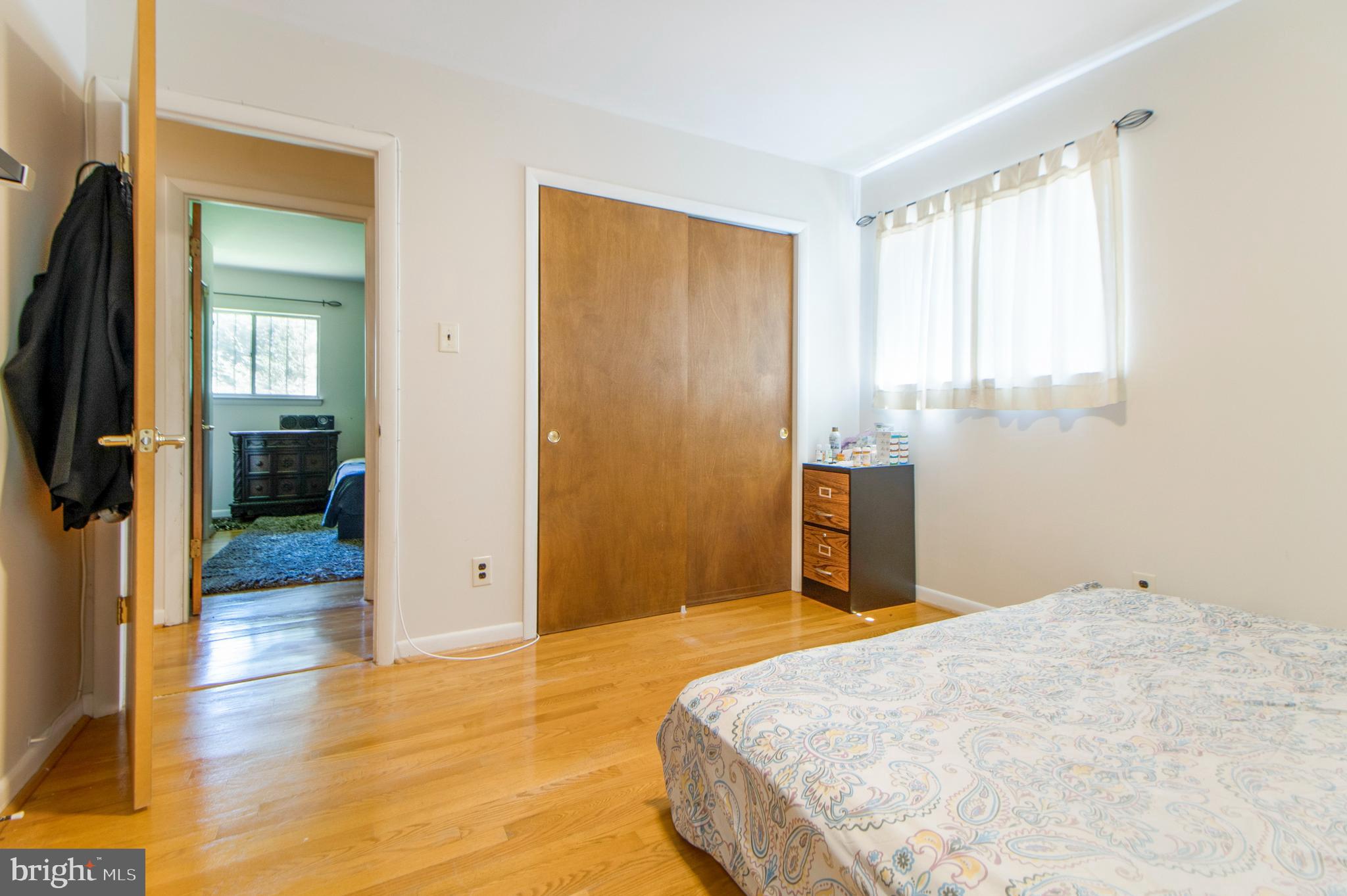 6311 Barrs Lane Lanham, MD 20706 - Photo 20 of 54 a bedroom with a bed and wooden floor