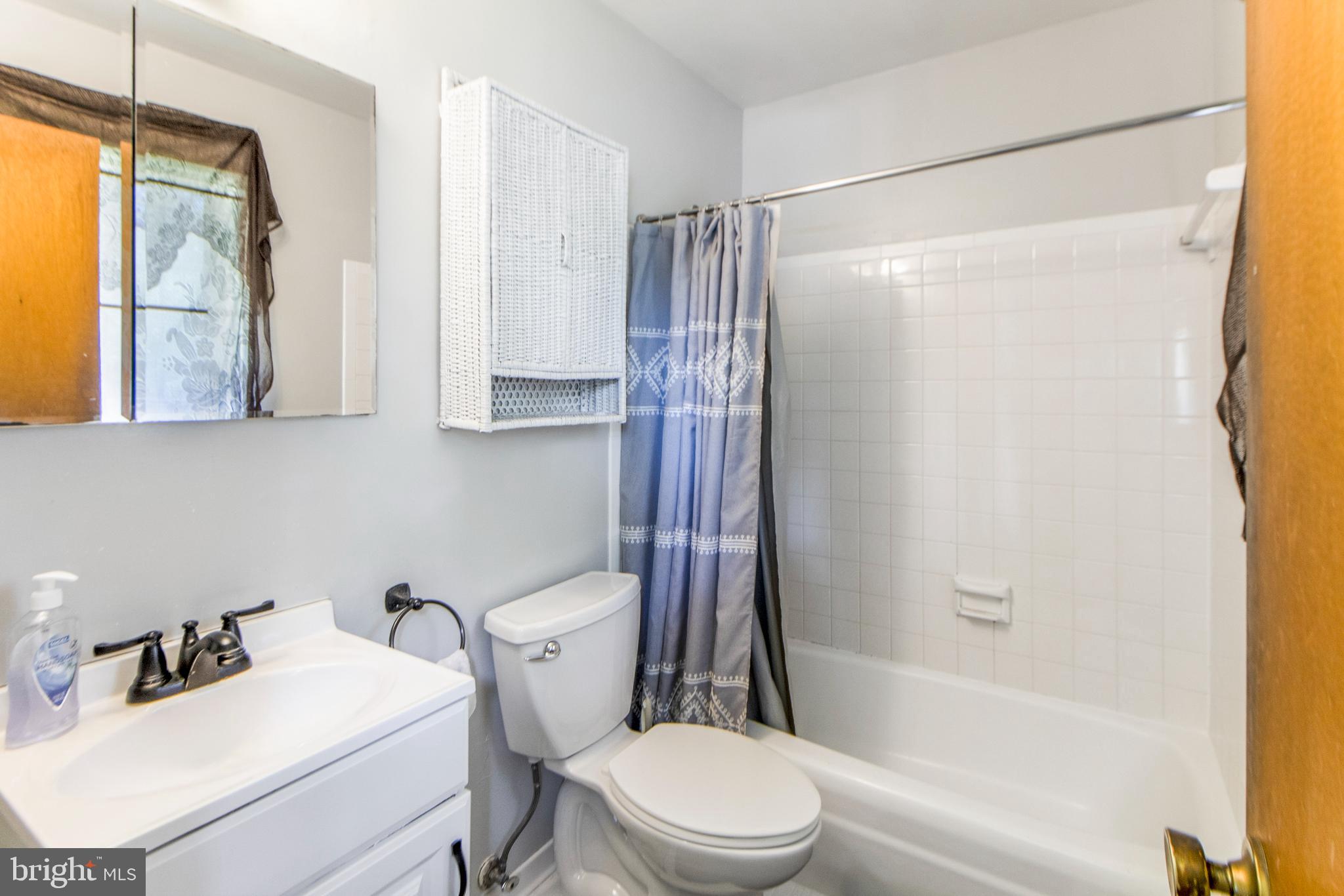 6311 Barrs Lane Lanham, MD 20706 - Photo 21 of 54 a bathroom with a sink toilet and shower