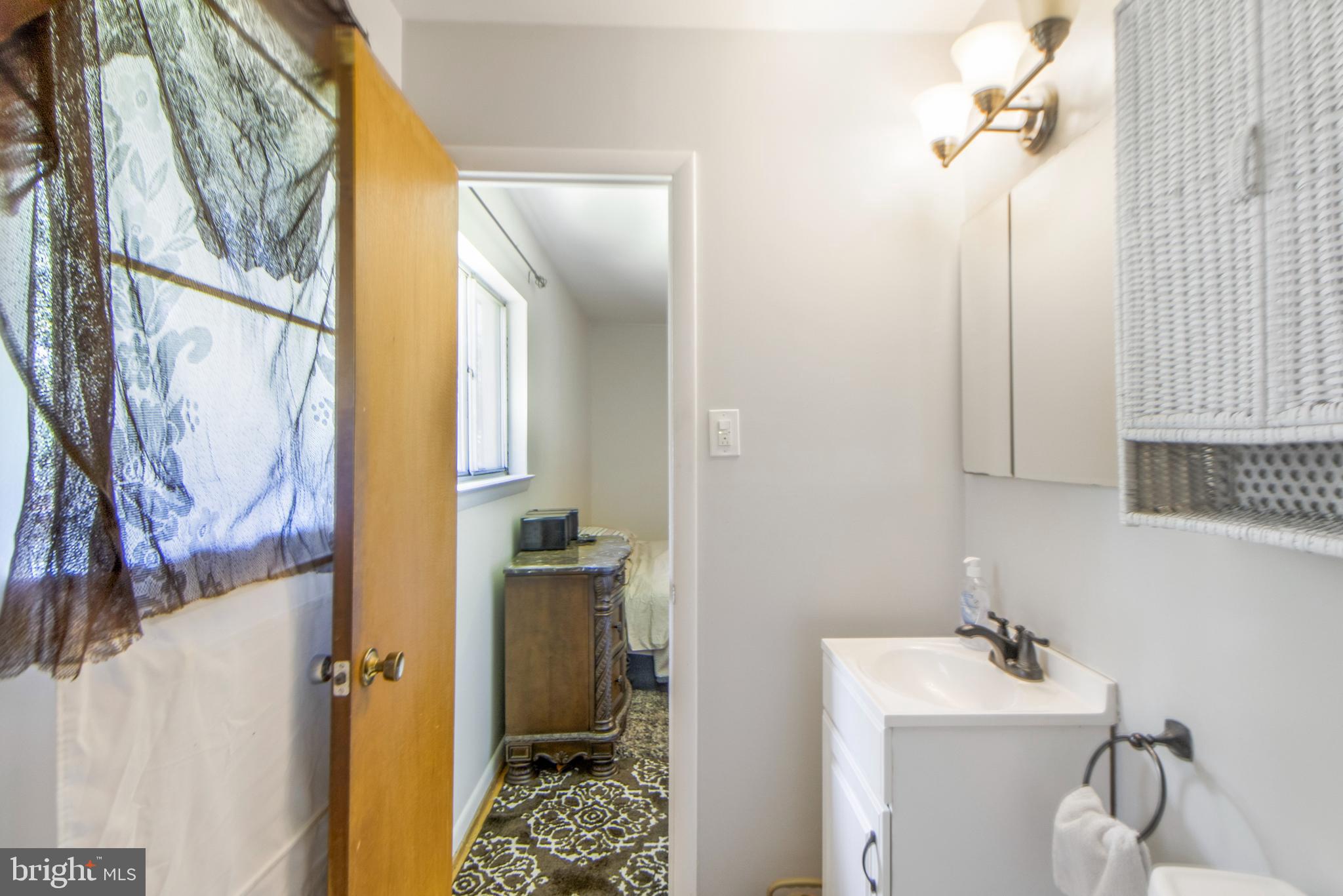 6311 Barrs Lane Lanham, MD 20706 - Photo 22 of 54 a bathroom with a sink toilet and shower
