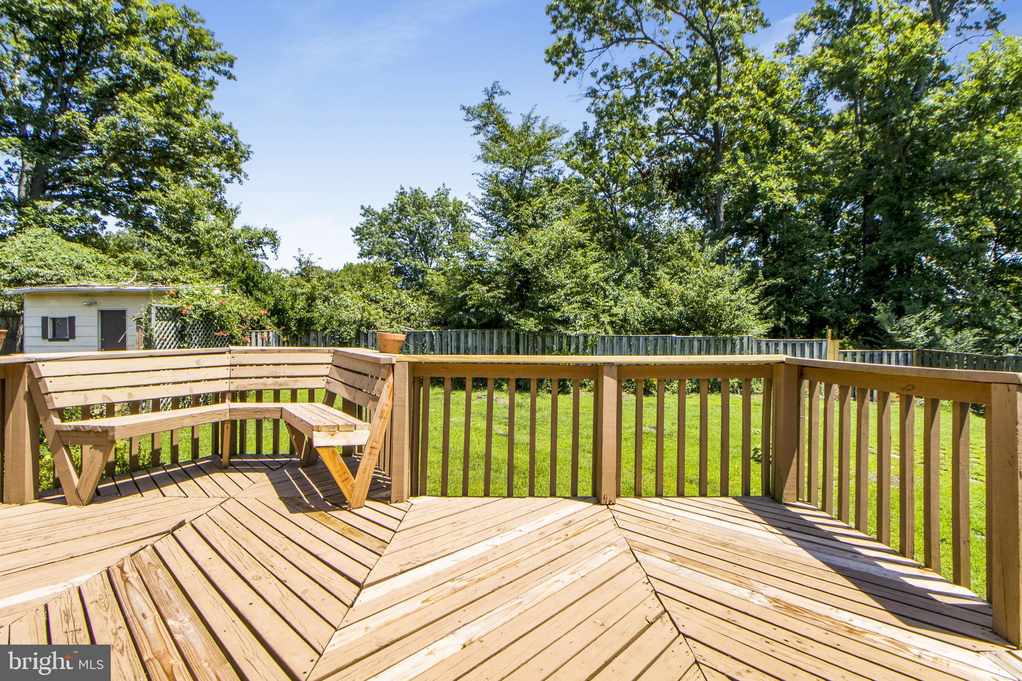 6311 Barrs Lane Lanham, MD 20706 - Photo 32 of 54 a view of balcony with wooden floor and fence