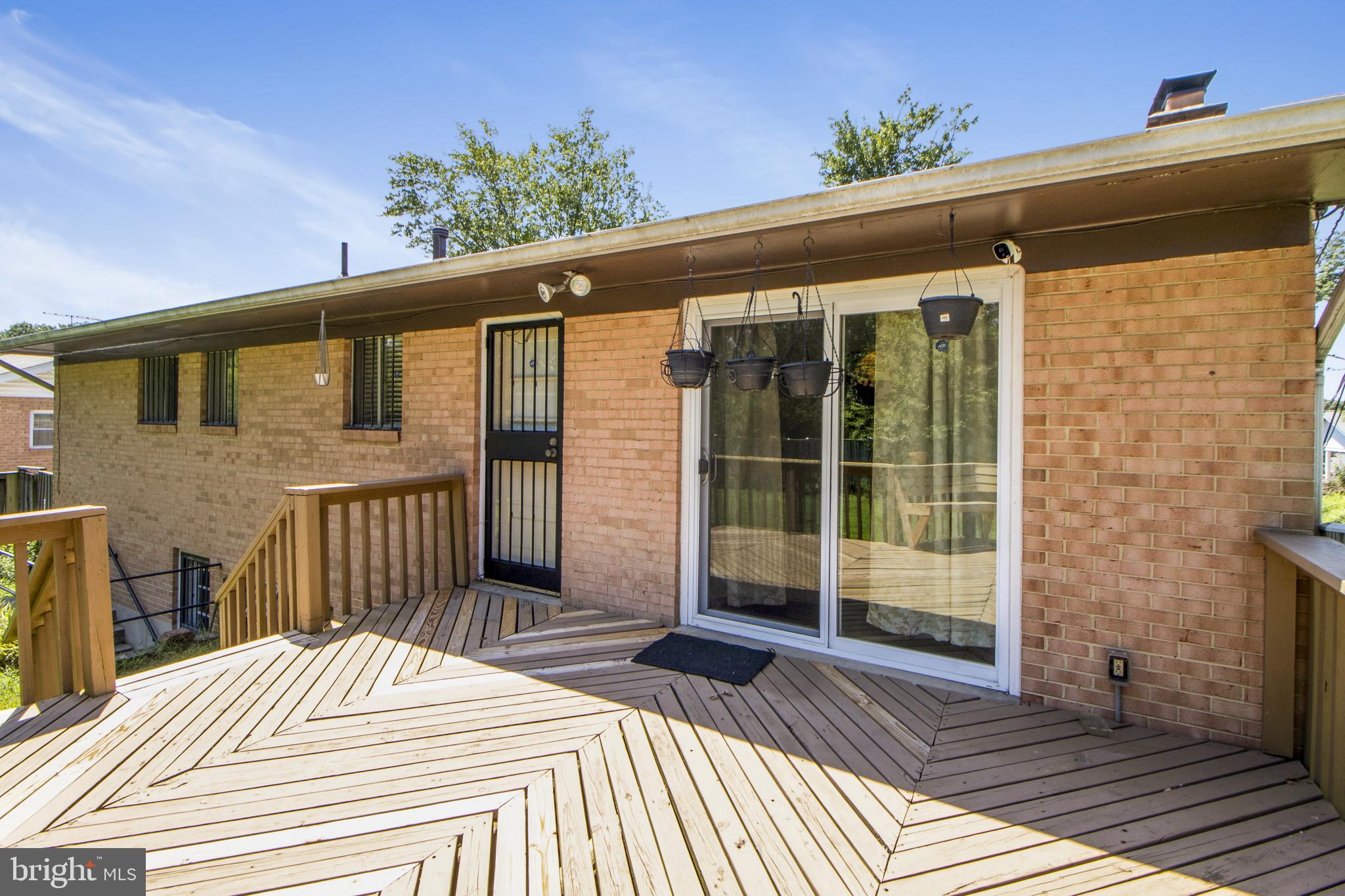 6311 Barrs Lane Lanham, MD 20706 - Photo 33 of 54 a view of a house with a porch