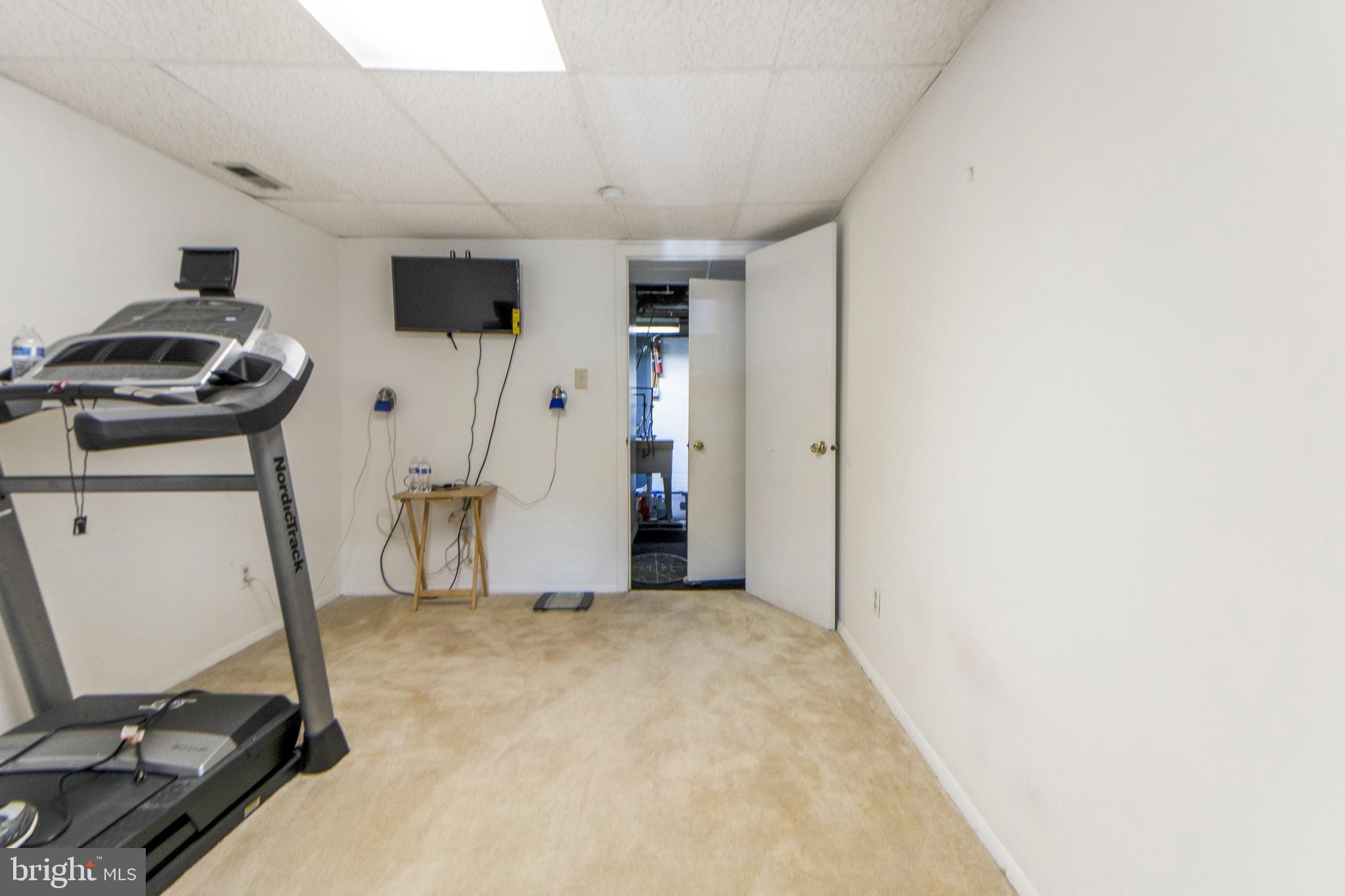 6311 Barrs Lane Lanham, MD 20706 - Photo 38 of 54 a view of a room with gym equipment