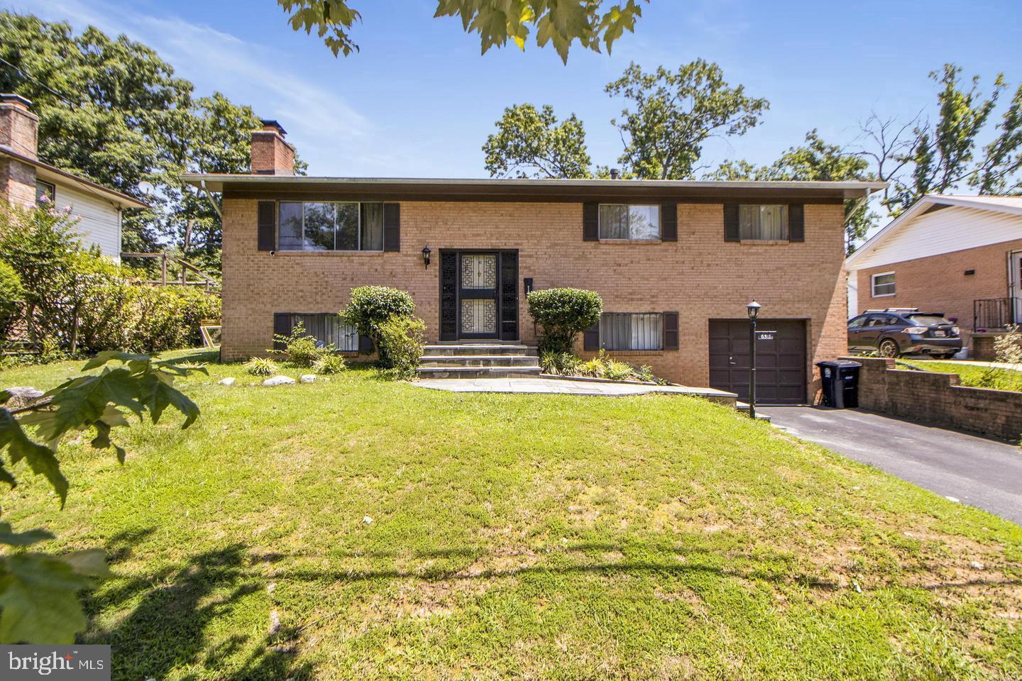 6311 Barrs Lane Lanham, MD 20706 - Photo 39 of 54 a house view with swimming pool in front of it