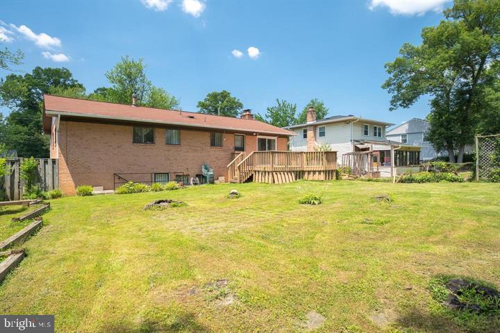 6311 Barrs Lane Lanham, MD 20706 - Photo 40 of 54 a front view of a house with a yard