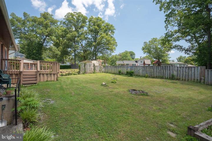 6311 Barrs Lane Lanham, MD 20706 - Photo 41 of 54 a view of a garden with wooden fence