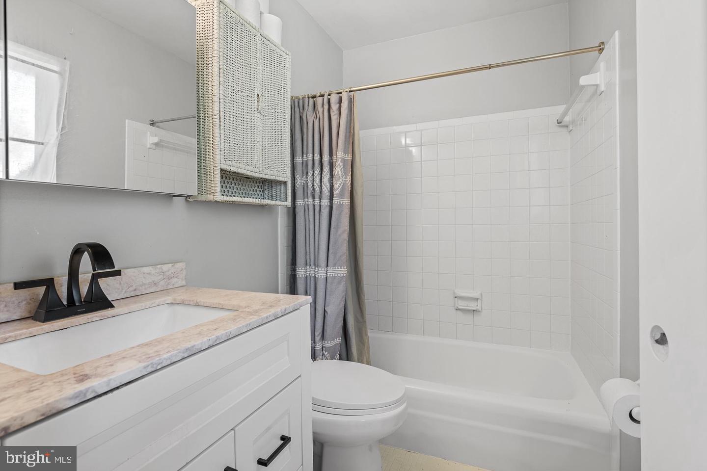 6311 Barrs Lane Lanham, MD 20706 - Photo 50 of 54 a bathroom with a sink toilet and shower