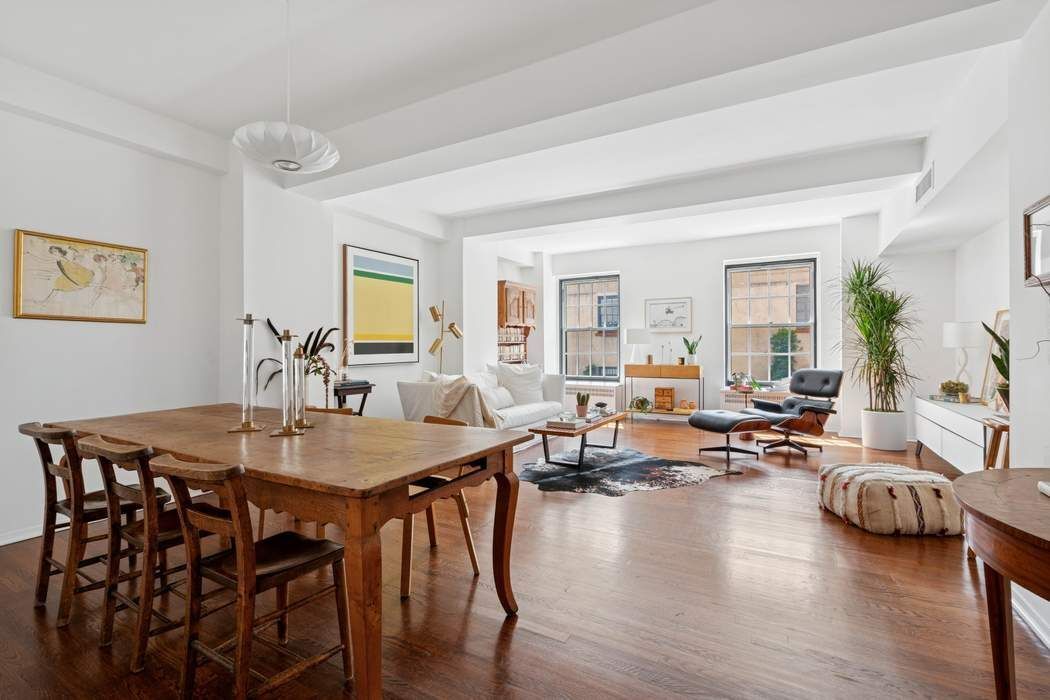 1 5th Avenue, Unit 2J Manhattan, NY 10003 - Photo 2 of 19 a living room with furniture dining table and wooden floor