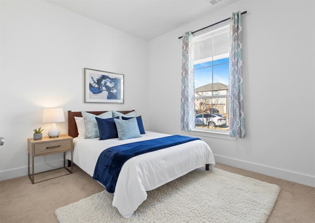 1136 Saddle Ridge Drive Aubrey, TX 76227 - Photo 15 of 26 a bed room with a bed and a window