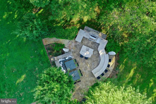 a view of entryway and dining room and wooden floor