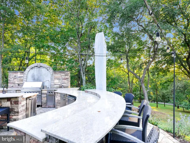 a view of dining room with wooden floor and furniture