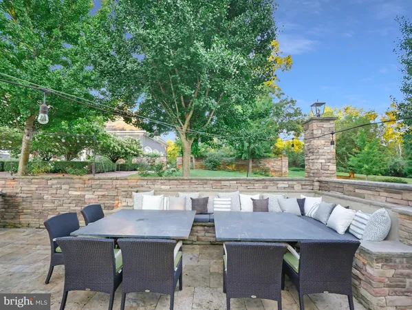 a spacious bedroom with a large bed and a chandelier