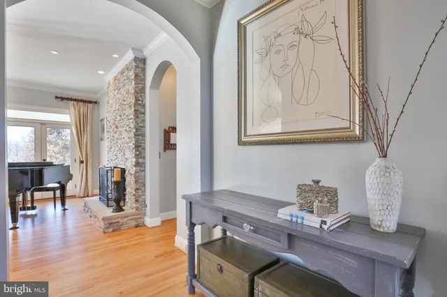 a view of a livingroom with furniture and a fan
