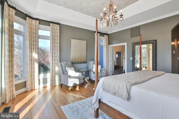 a bedroom with a bed and a dresser in it