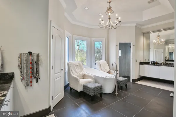 a bathroom with a sink and mirror with toilet