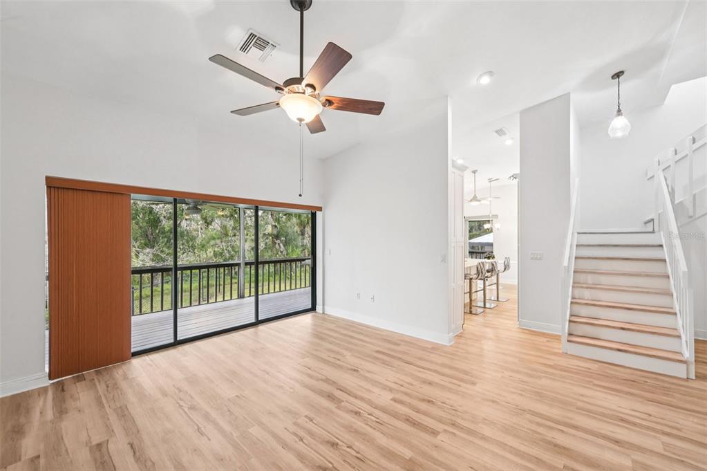 13221 North Branch Road Sarasota, FL 34240 - Photo 12 of 64 a view of an empty room with wooden floor and a window