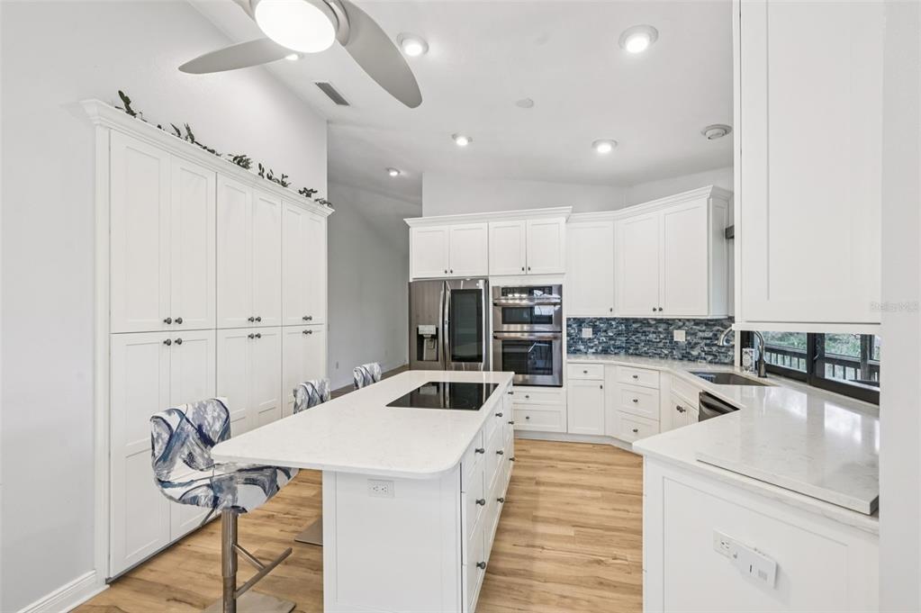 13221 North Branch Road Sarasota, FL 34240 - Photo 14 of 64 a kitchen with a sink a counter top space stainless steel appliances and cabinets
