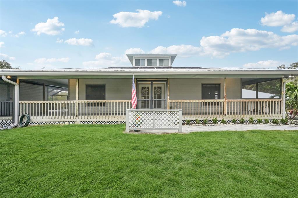 13221 North Branch Road Sarasota, FL 34240 - Photo 2 of 64 a front view of a house with a garden