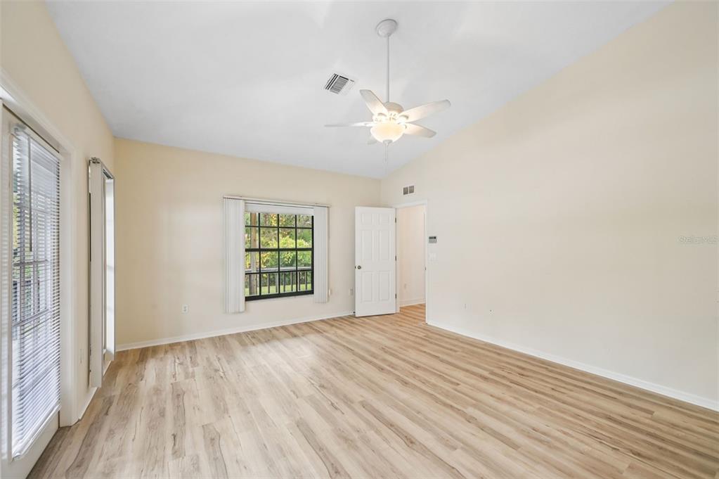 13221 North Branch Road Sarasota, FL 34240 - Photo 24 of 64 wooden floor in an empty room with a window